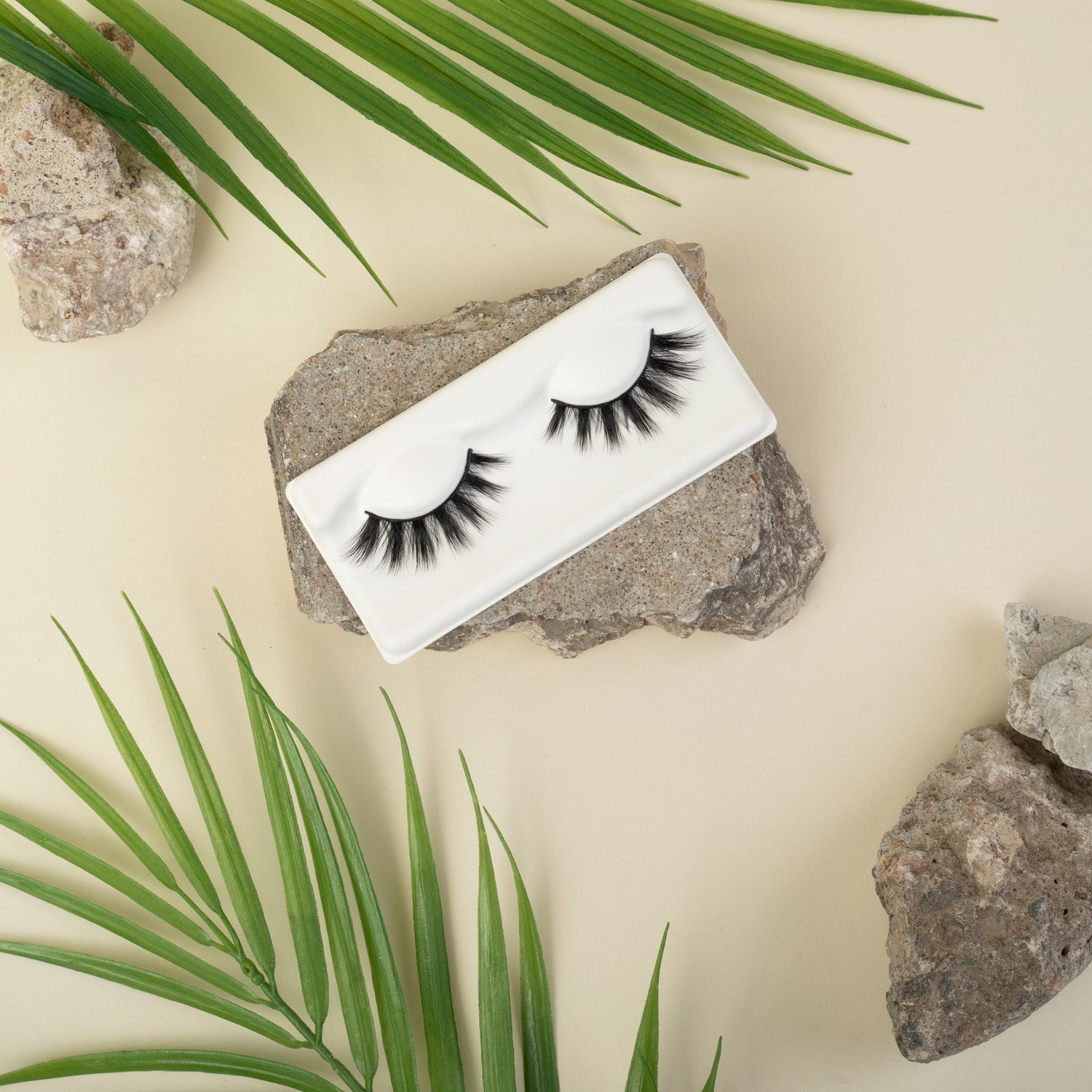 Criss Cross Lashes With Rock and Leaf Background