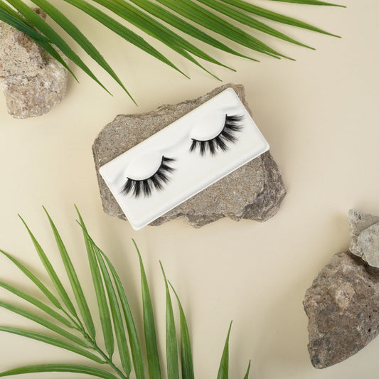 Criss Cross Lashes With Rock and Leaf Background