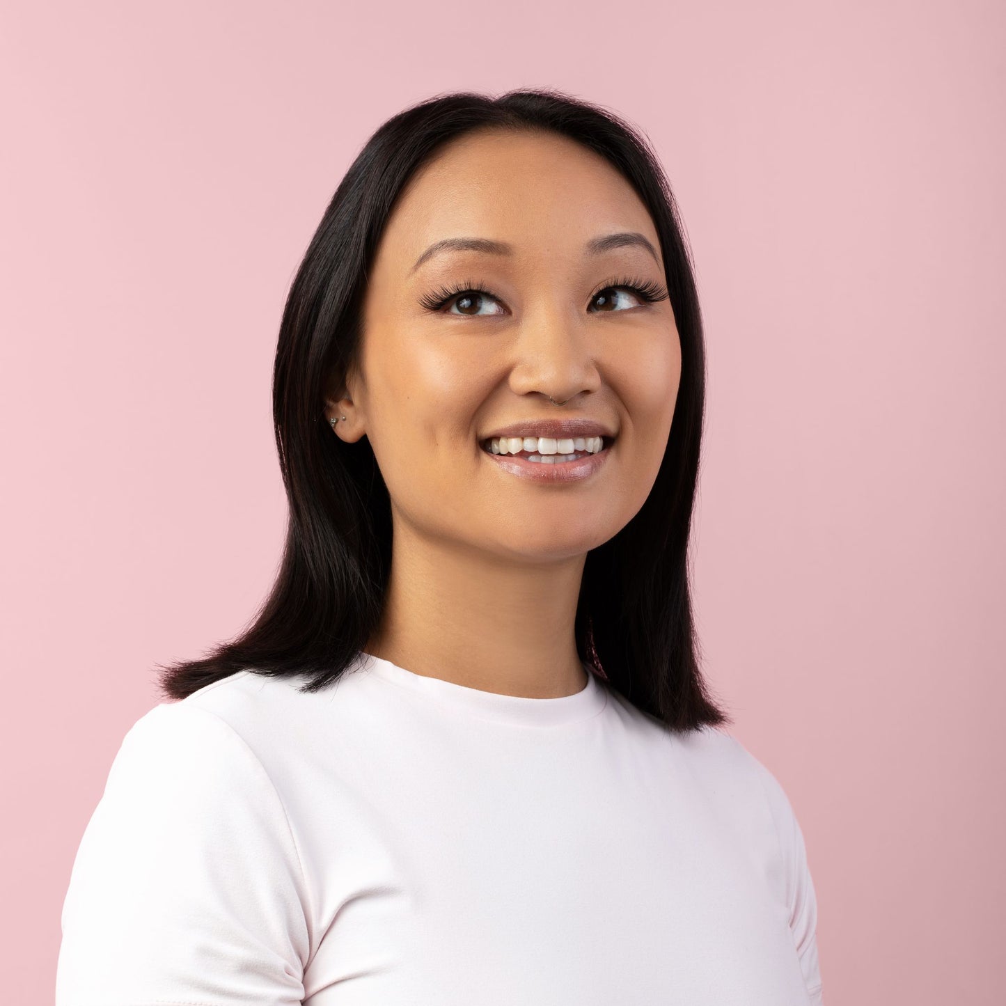 Girl With Black Hair Smiling Wearing Ecolashes