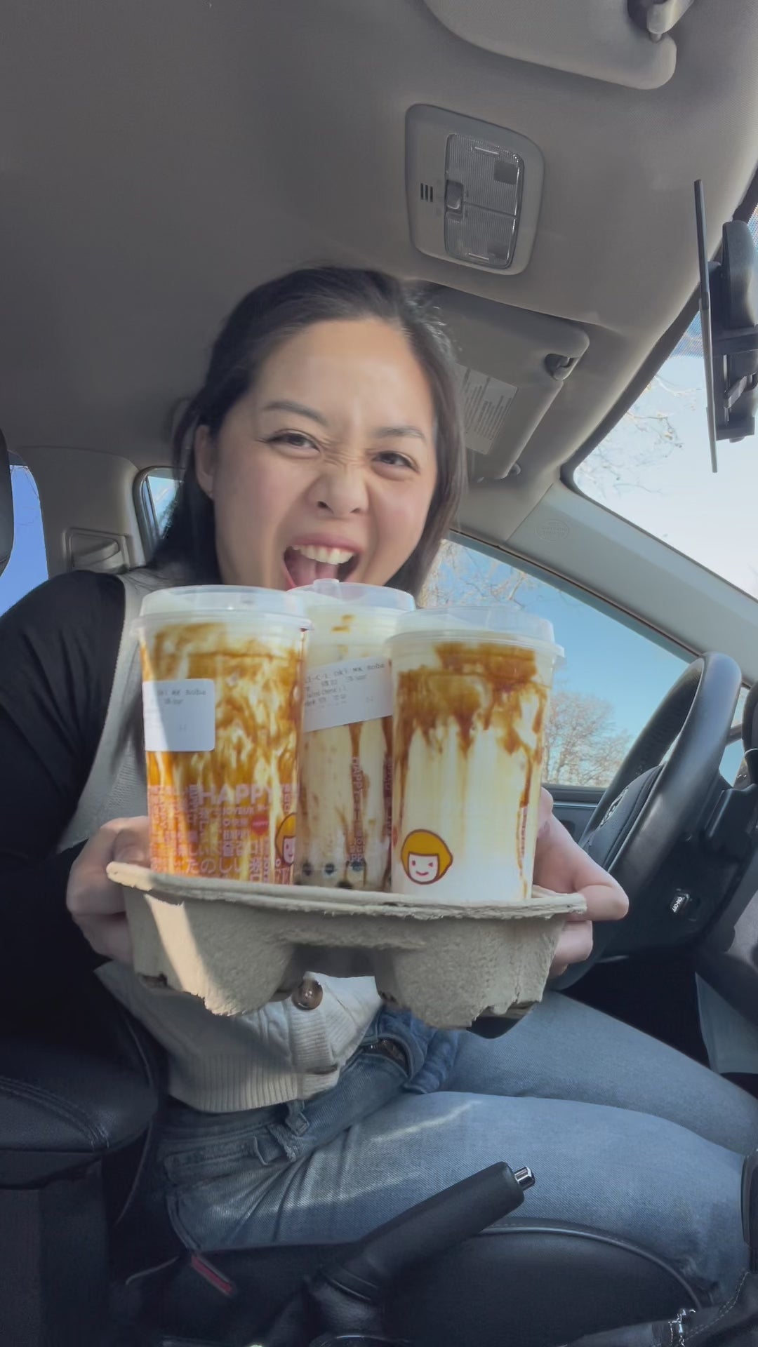 Girl drinking boba with boba themed lashes on